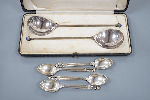 Four Georg Jensen sterling teaspoons, with Jensen box and a cased pair of continental white metal spoons, with cabochon terminals, gross 183 grams.